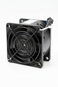 Computer fan on a wooden surface with a blurred background