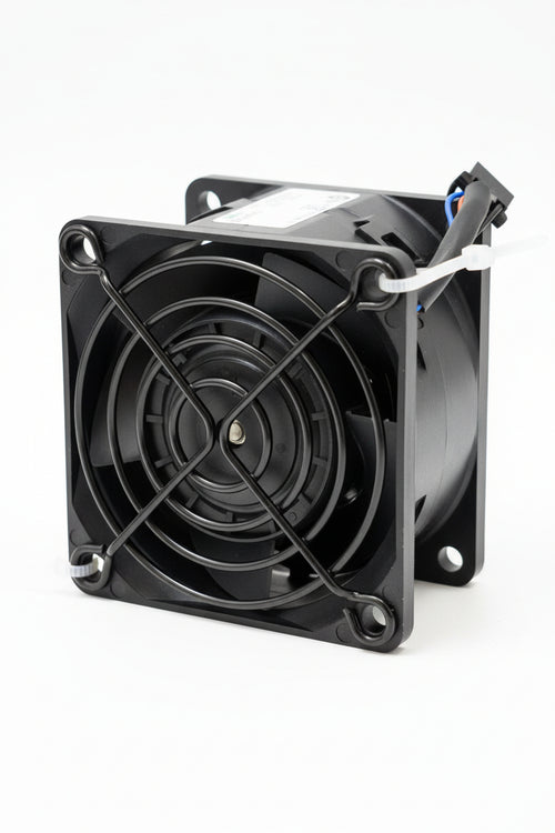 Computer fan on a wooden surface with a blurred background